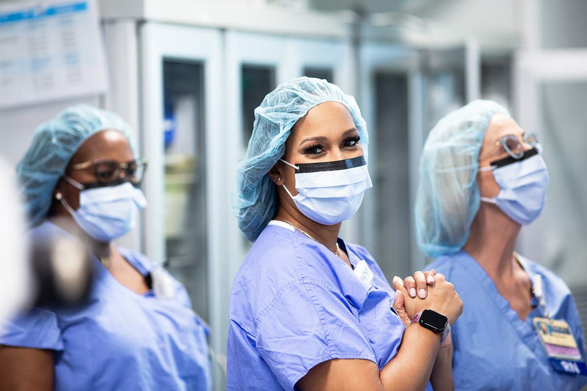 Nurse in OR room ensures sterile environment.