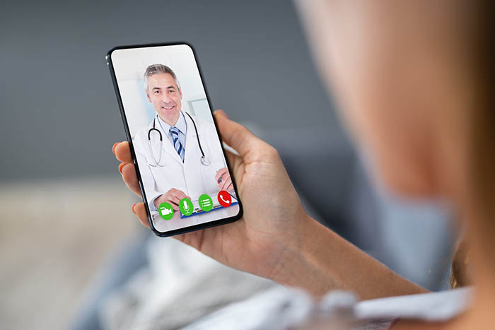 Patient talking to a Doctor via a phone using Telehealth
