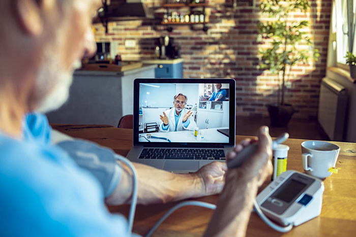 A patient talking to a doctor via telehealth
