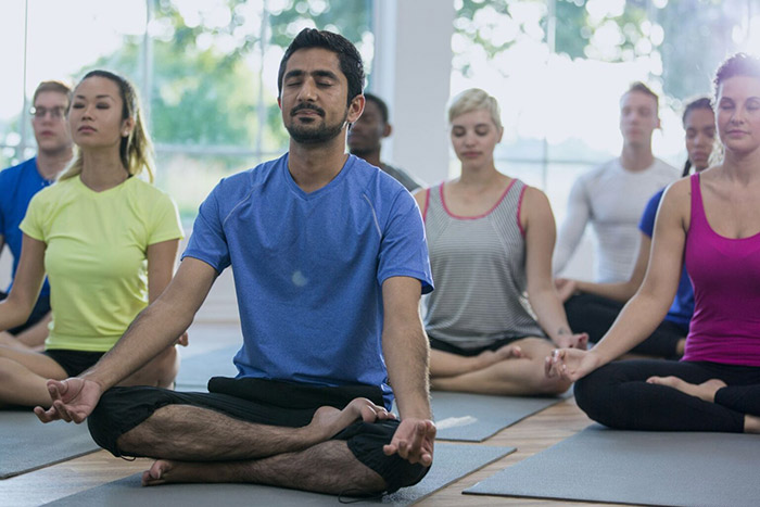 Group of people doing Yoga