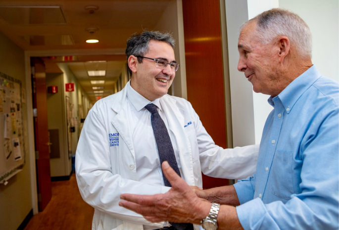 Dr Billen greets patient Greg