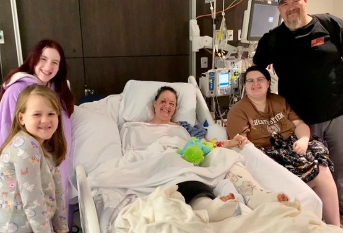 Patient Astra with her family at the hospital