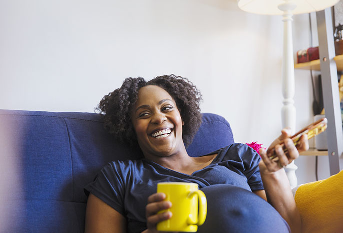 Pregnant woman laughing