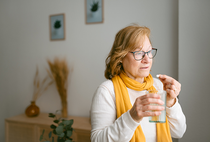 Woman taking supplements