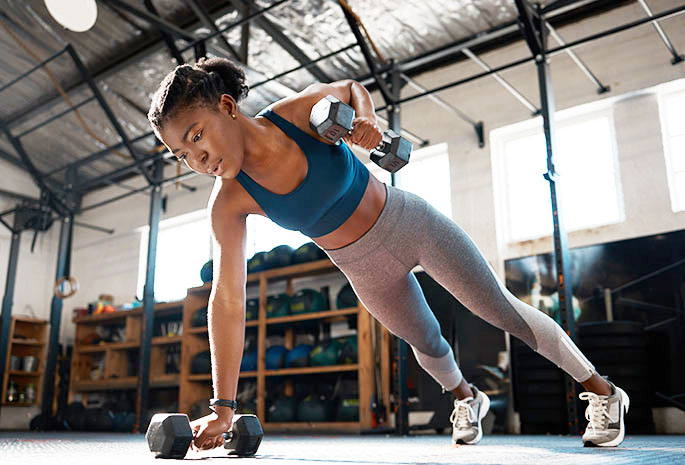 Young woman working out inside the gym