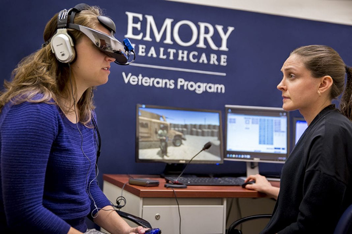 Woman wearing virtual reality goggles at an Emory Healthcare Veterans Program event